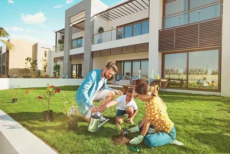 Family time in the garden of a Hawana Lagoon home